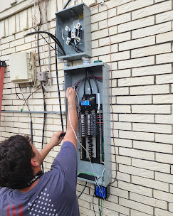 ABR Electric technician completing an outdoor electrical panel change in Plano, Texas