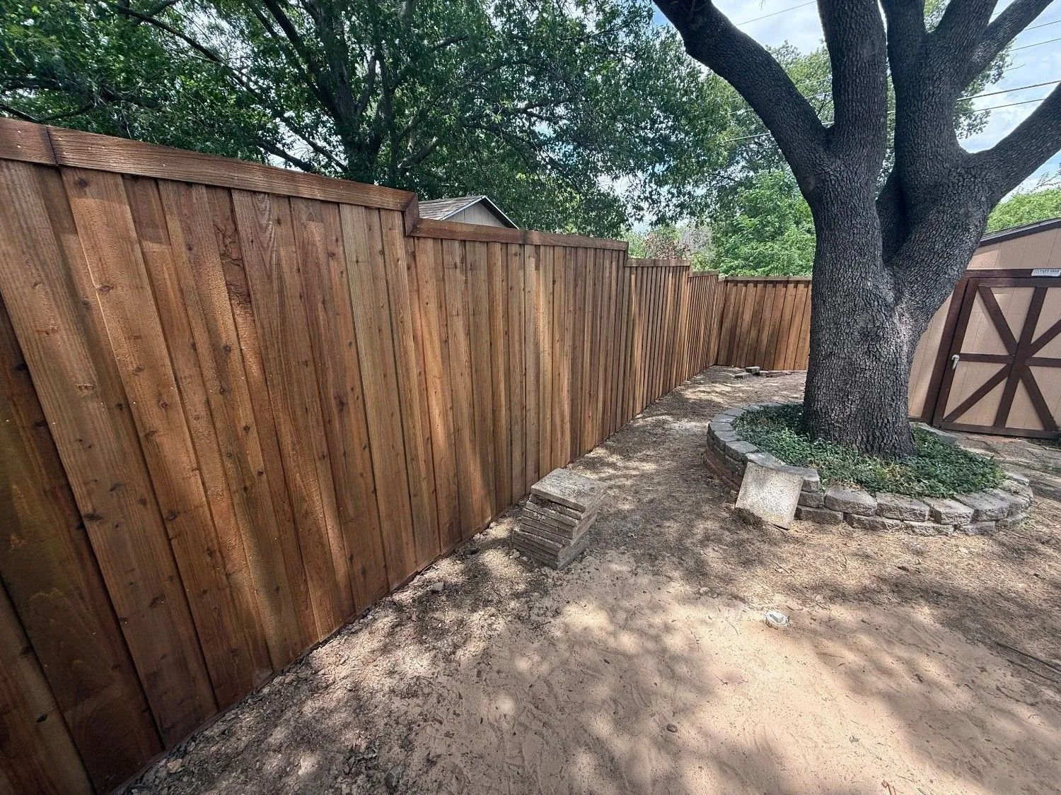 Wood privacy fence installed by Mom's Fence Man
